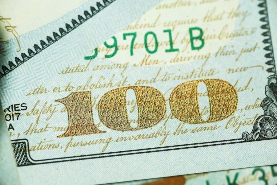 A close up of a 100 dollar bill.